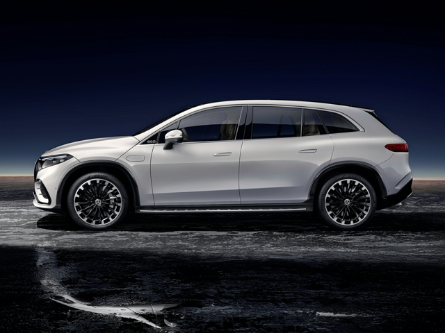 Gemini said Side profile of a white Mercedes-Benz EQS SUV on dark ground.