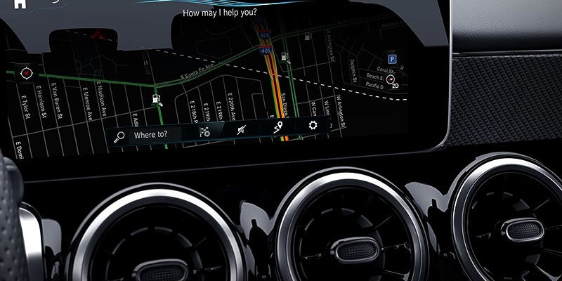Close-up of the digital dashboard and round air vents.