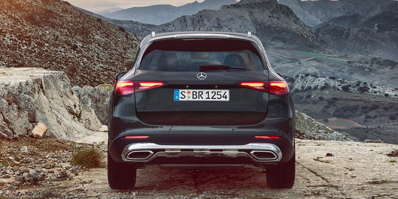 Rear view of a dark grey Mercedes-Benz GLC SUV.