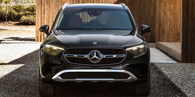 Front view of a black Mercedes-Benz GLC SUV parked outdoors.