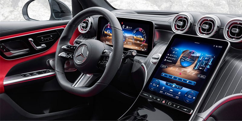 Close-up of a modern steering wheel and digital dashboard display.