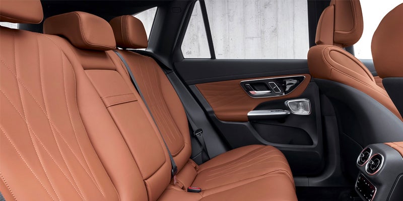 Close-up of a modern steering wheel and digital dashboard display.