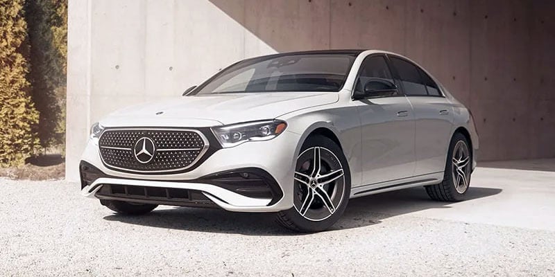 Front three-quarter view of a white Mercedes-Benz luxury sedan